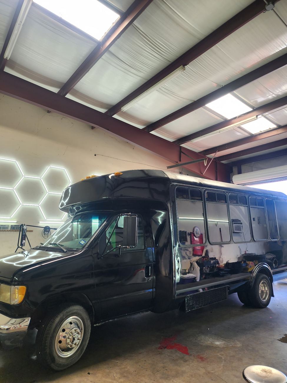 The glossy black Party Hopper bus